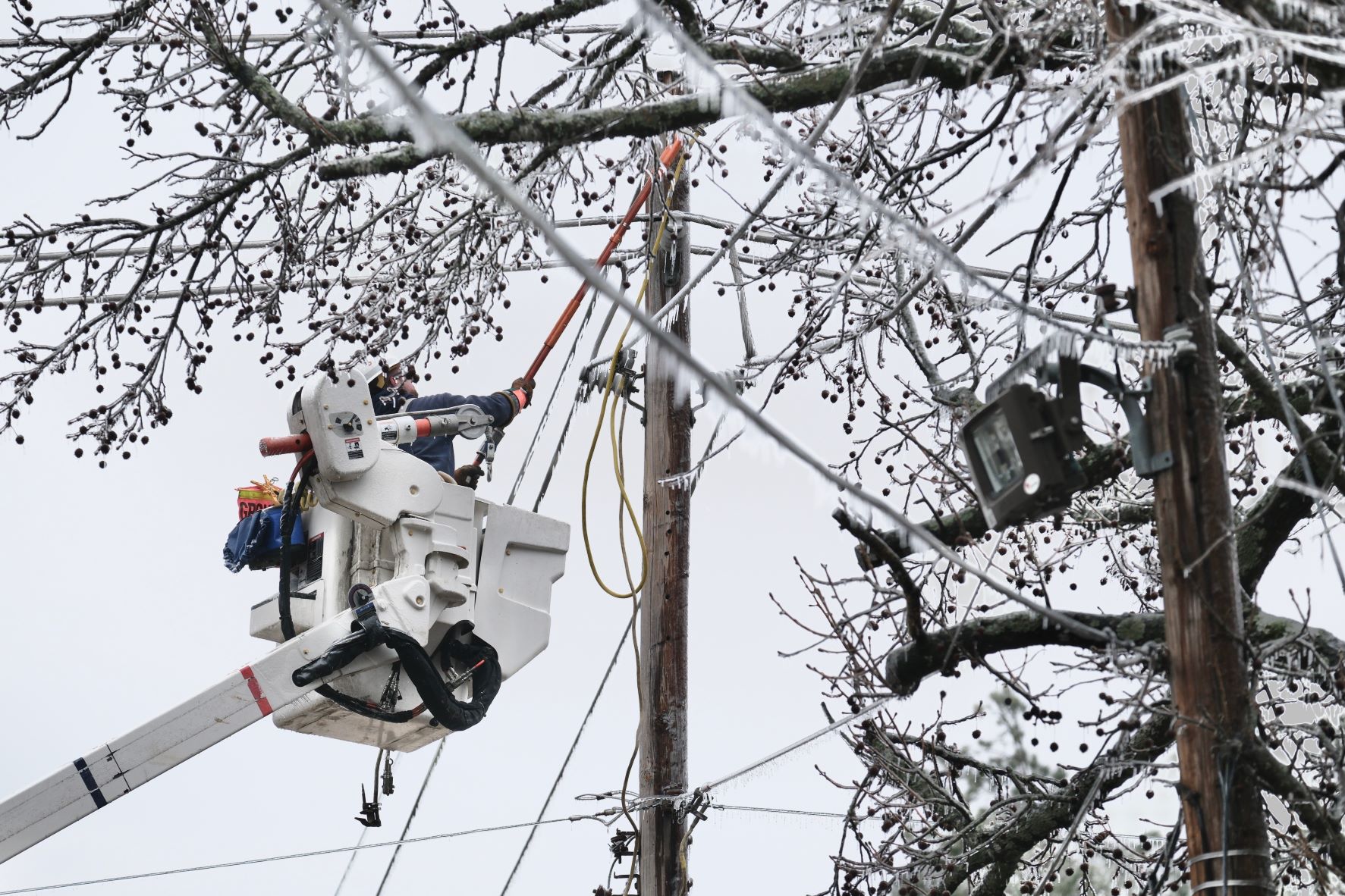 A lineman works to restore power in Pine Bluff.